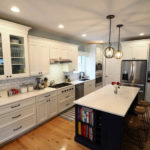 large kitchen with white cupboards